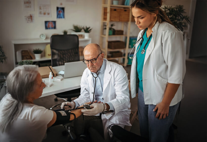 Doctor and nurse with patient.