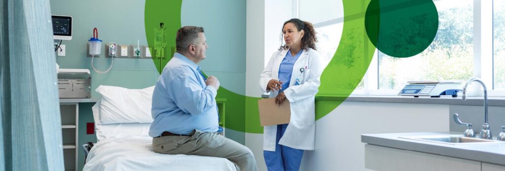 Patient and doctor talking in doctor's office.